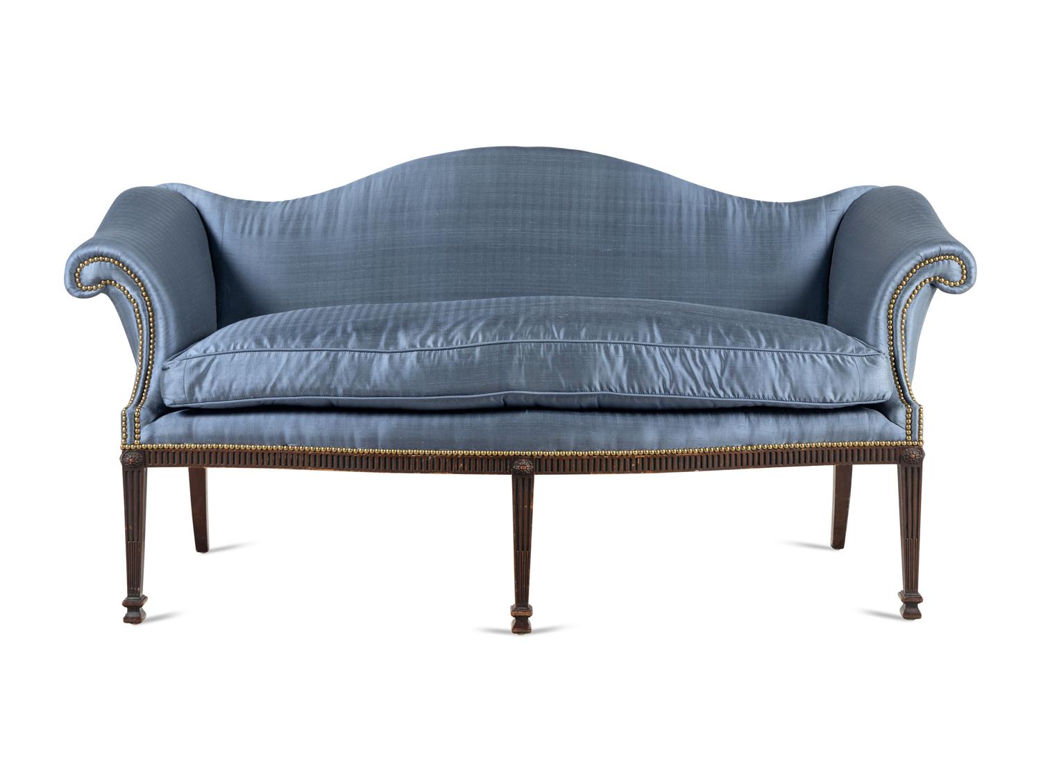 A George III Style Carved Mahogany Camelback Sofa