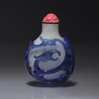 A Chinese Blue Overlay Glass Snuff Bottle, Qing Dynasty, Circa 1780-1830 — 1780-1830年 御製雪霏地套藍料龍紋鼻煙壺