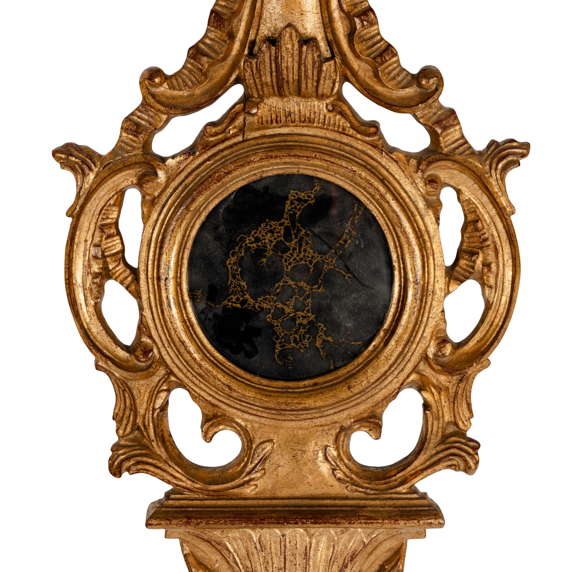 A Giltwood Banjo Form Wall Mirror