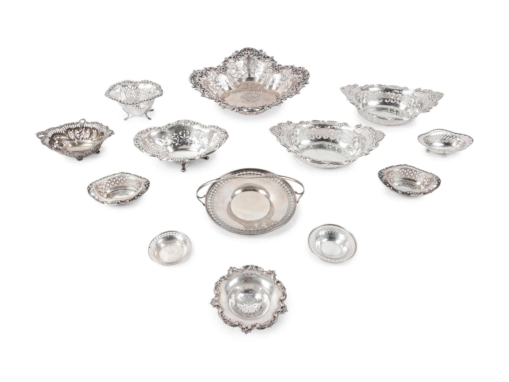 A Large Group of American Pierced Silver Dishes