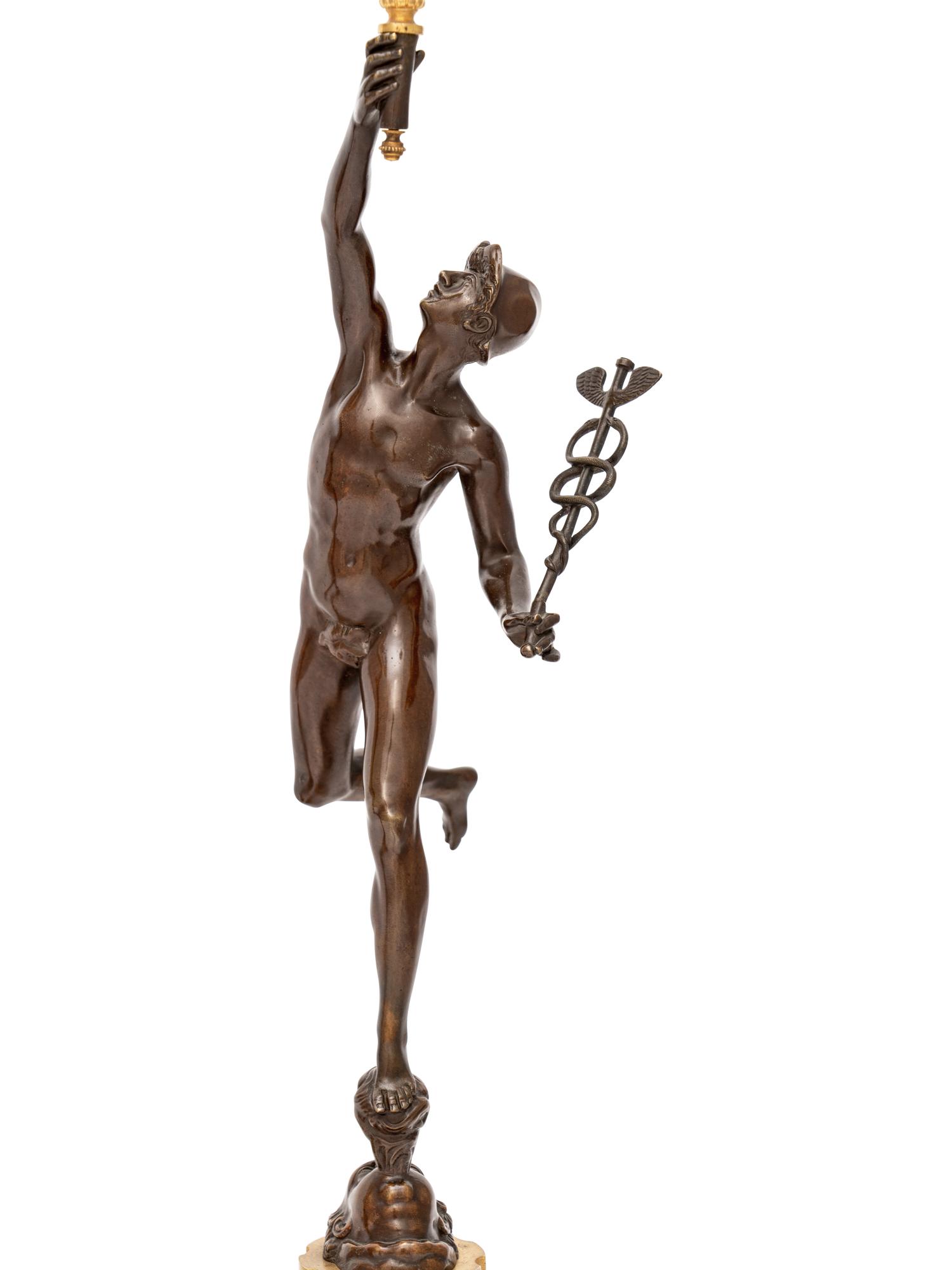 A Pair of Gilt and Patinated Bronze Figural Four-Light Candelabra
