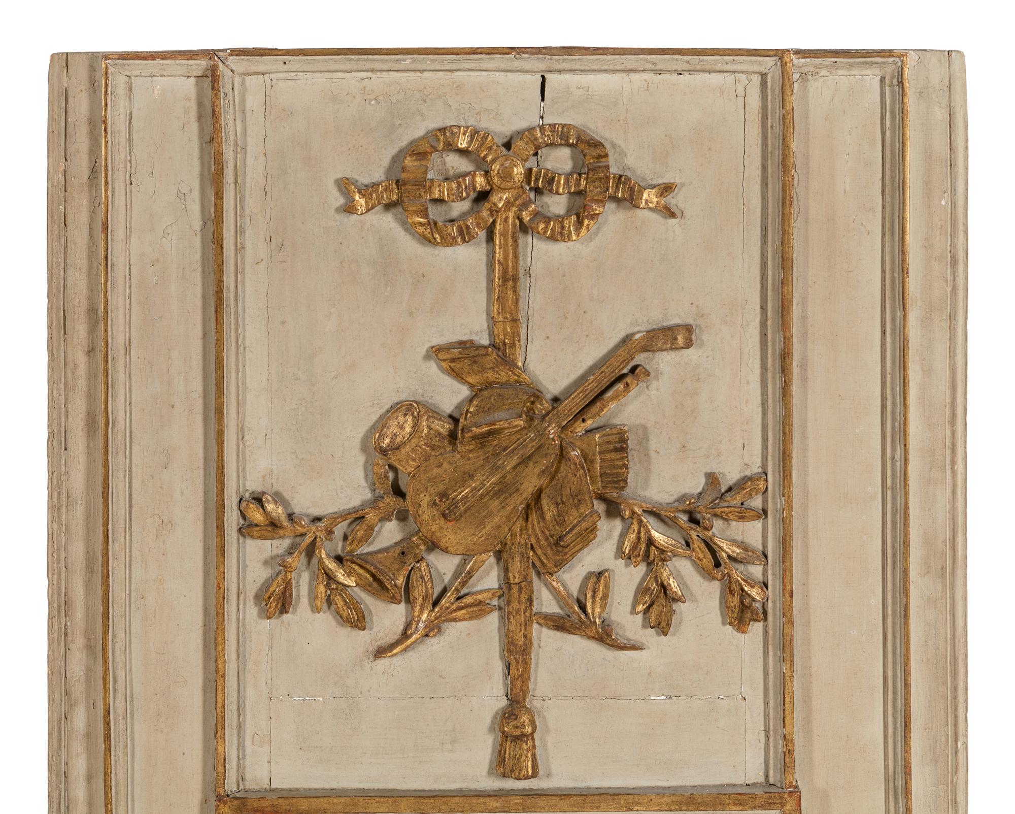 A Louis XVI Style Gray Painted and Parcel Gilt Mirror