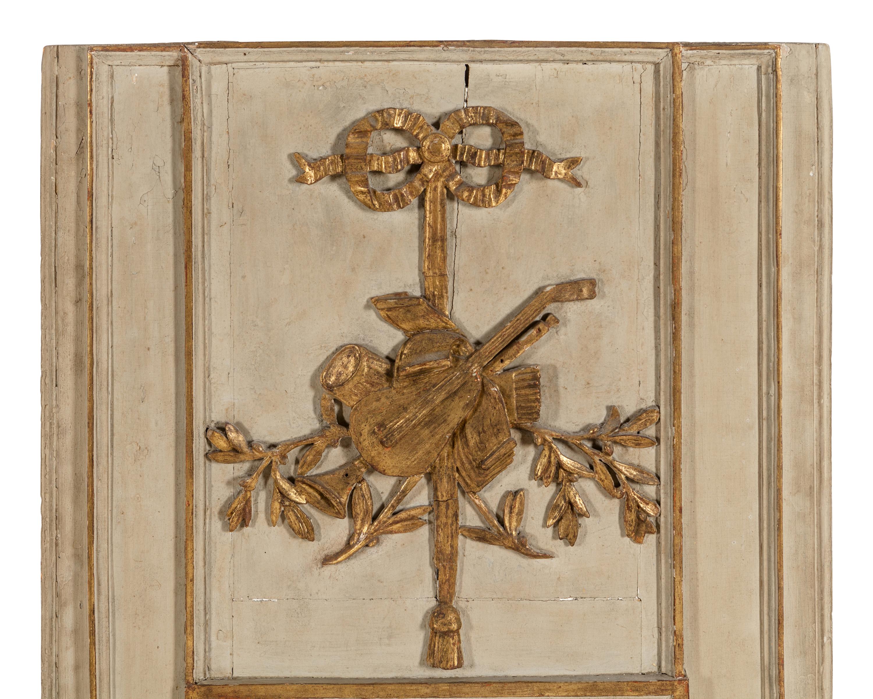 A Louis XVI Style Gray Painted and Parcel Gilt Mirror