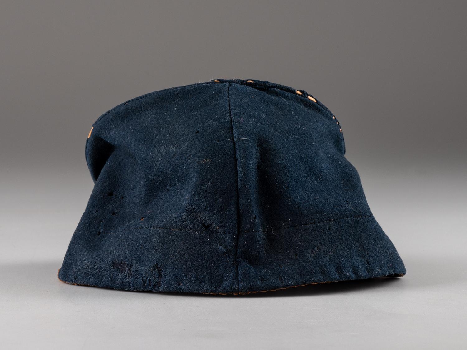 [CIVIL WAR]. Forage cap with contractor label featuring 104th regimental number and insignia.