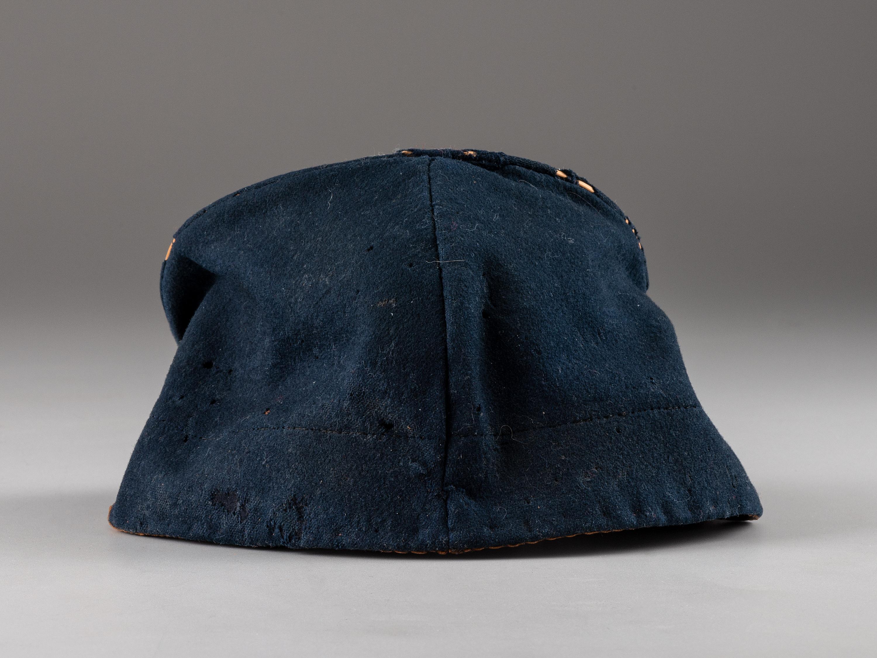[CIVIL WAR]. Forage cap with contractor label featuring 104th regimental number and insignia.