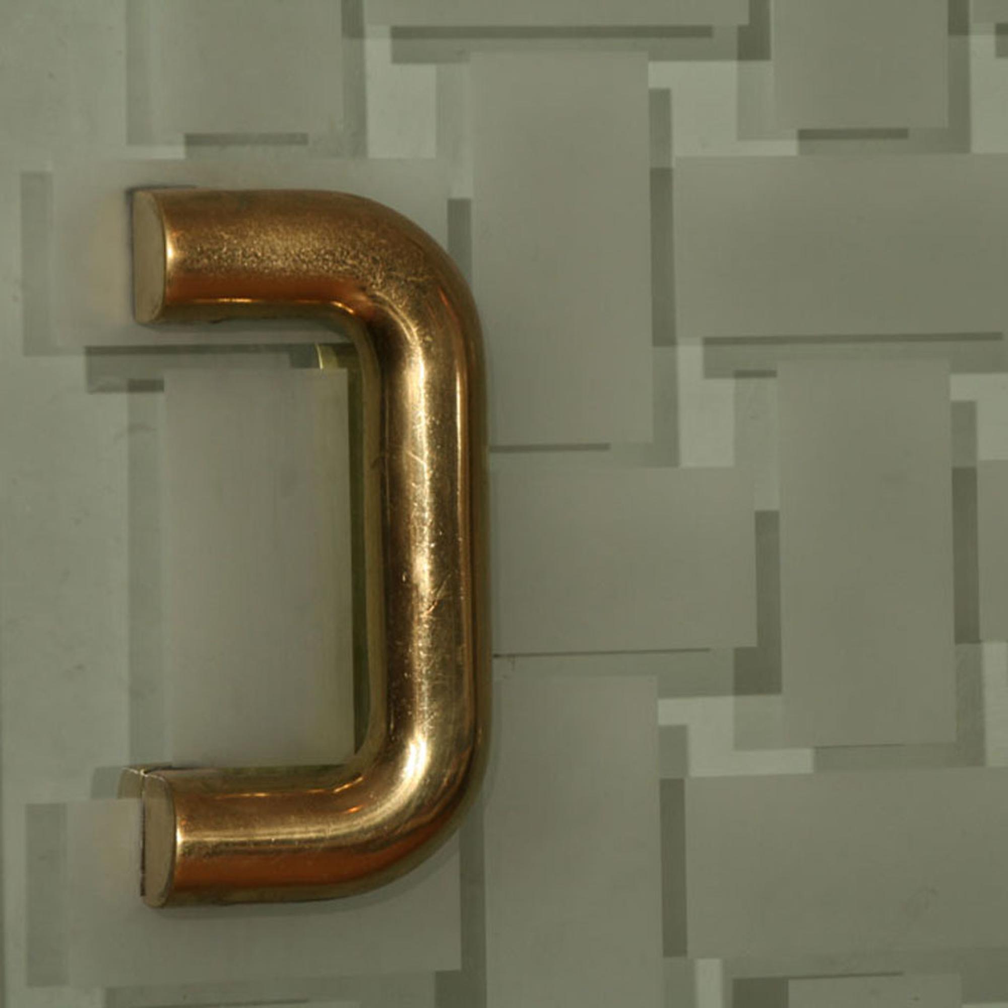 A Mid-Century Brass and Glass Entryway 72" W x 6" D x 96" H — United States, Mid-20th Century