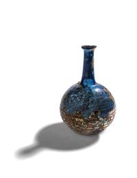 A Roman Blue Glass Bottle with Spiral Trail