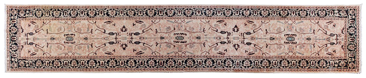 An Oriental Runner 13 feet 3 1/2 inches x 2 feet 10 1/4 inches.