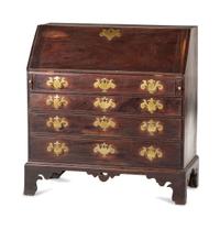 A Chippendale Carved and Figured Mahogany Slant-Front Desk