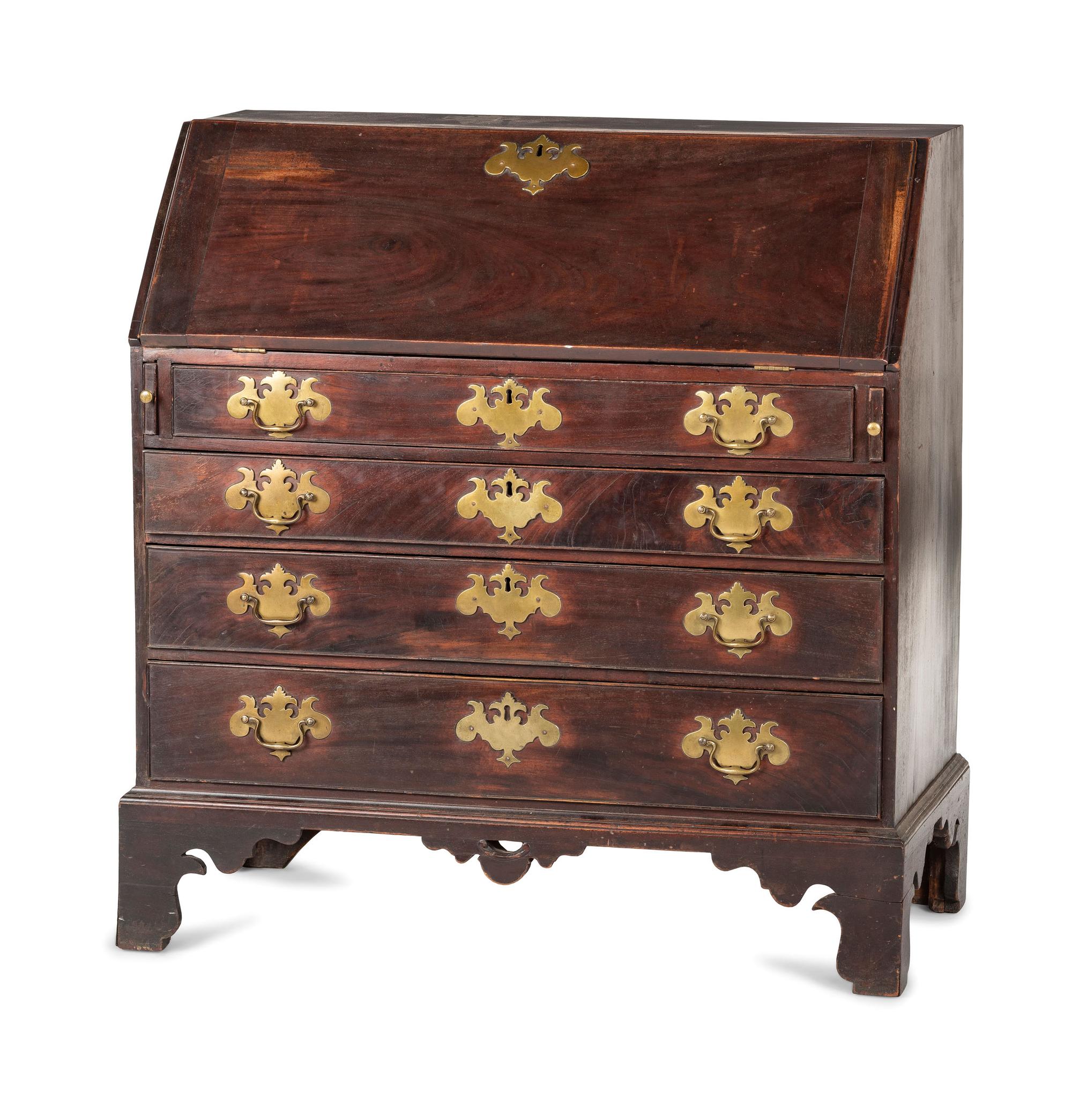 A Chippendale Carved and Figured Mahogany Slant-Front Desk