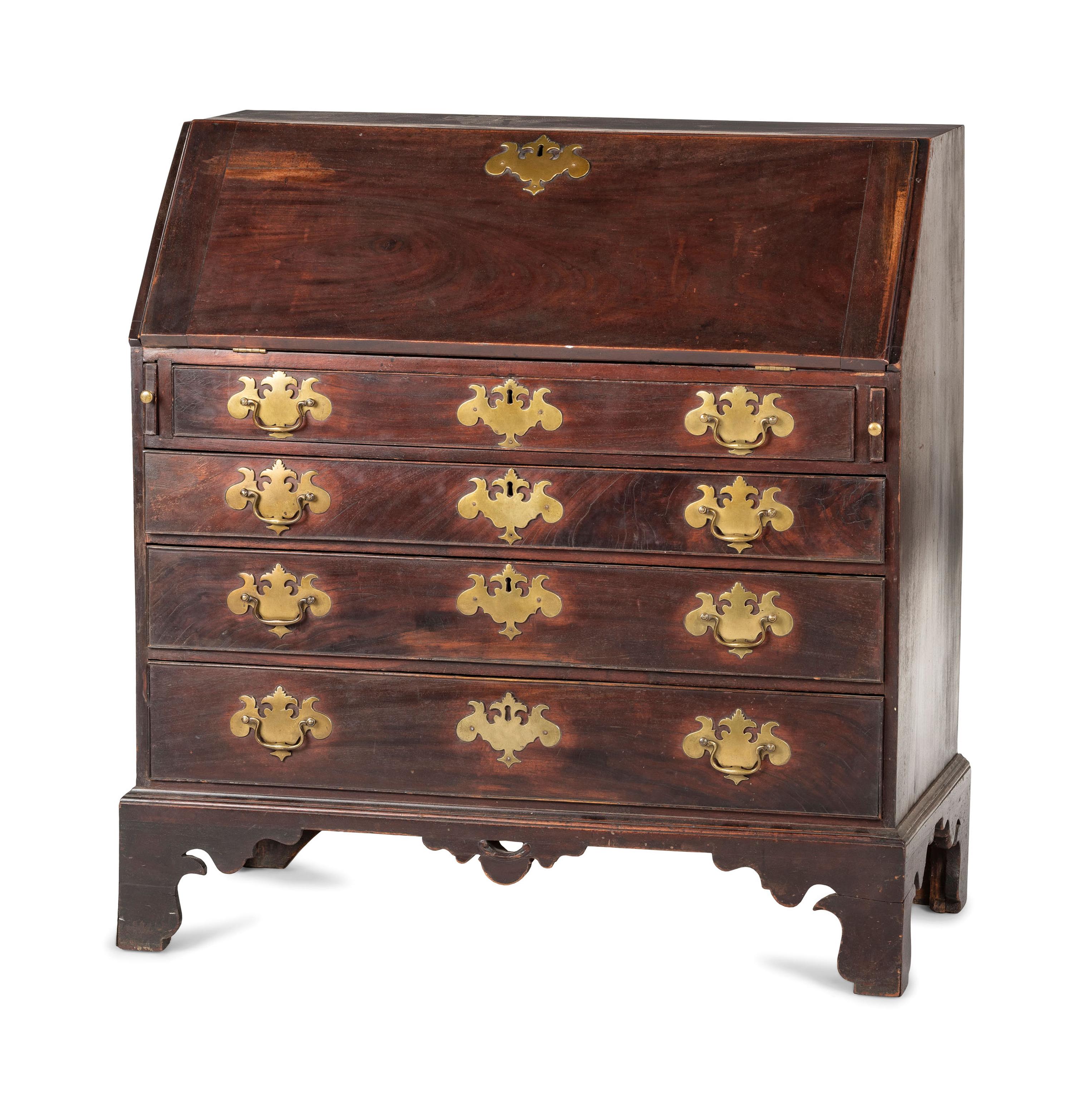 A Chippendale Carved and Figured Mahogany Slant-Front Desk