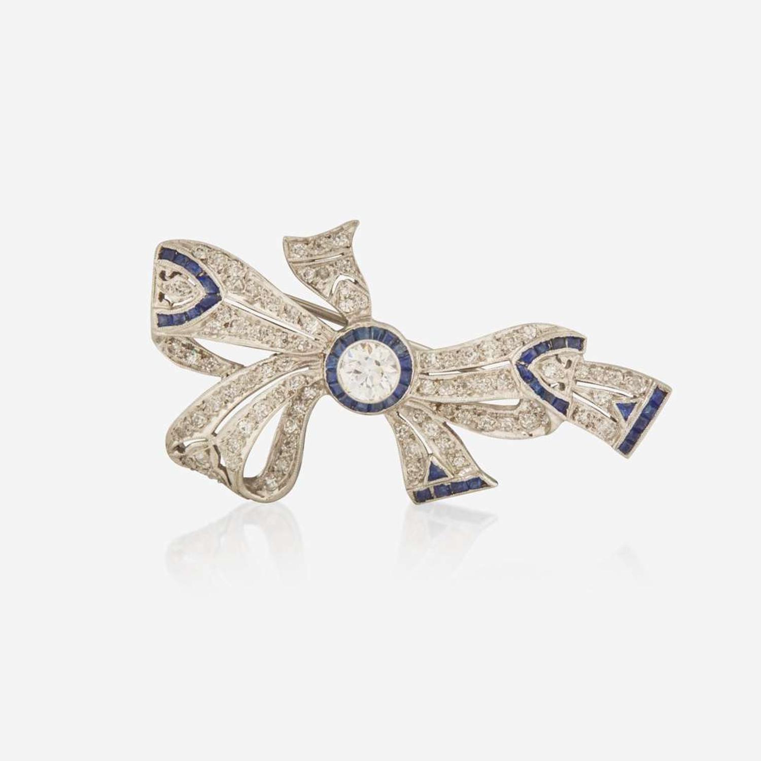 An Art Deco Platinum, Diamond, and Sapphire Brooch