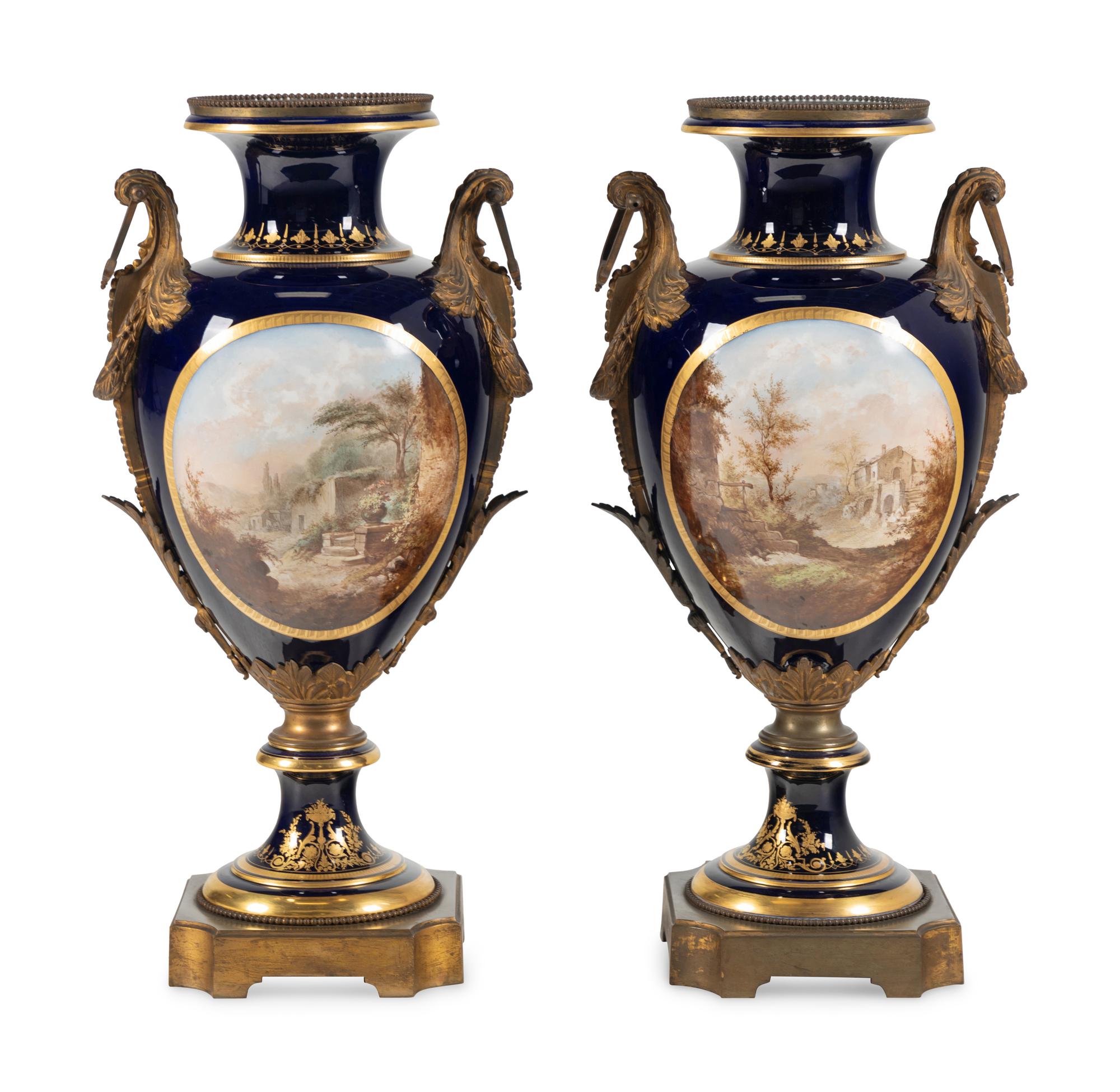 A Pair of Large Gilt Bronze Mounted Sèvres Style Porcelain Urns