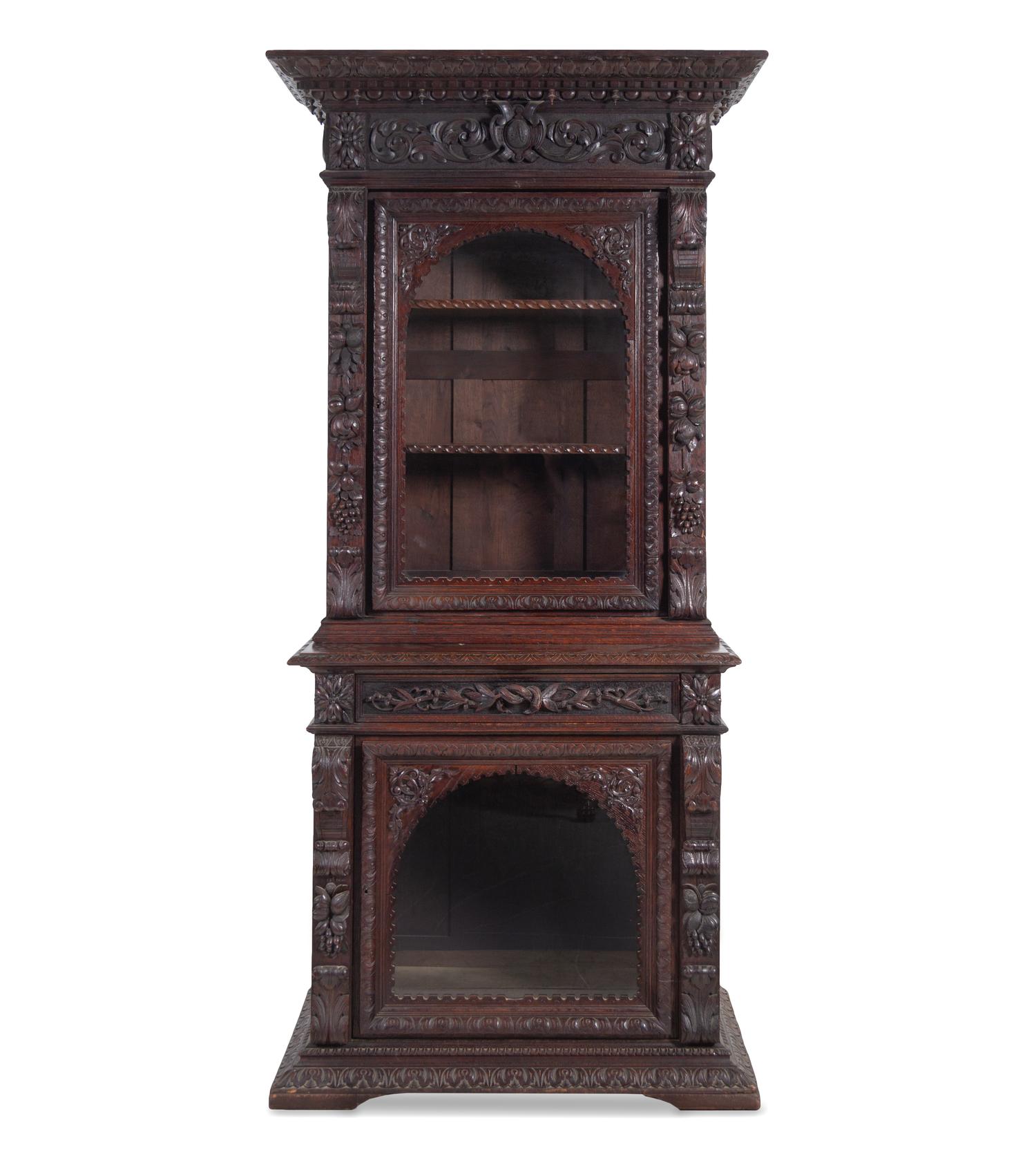 A Renaissance Revival Carved Oak Two-Part Cabinet