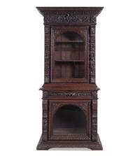 A Renaissance Revival Carved Oak Two-Part Cabinet