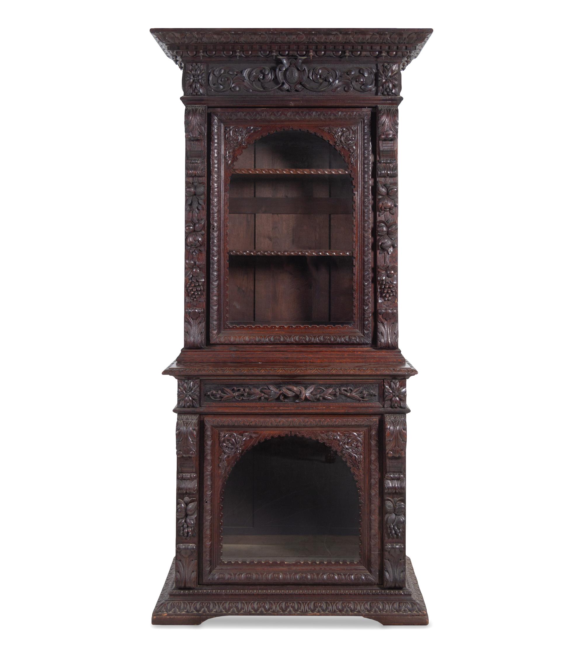 A Renaissance Revival Carved Oak Two-Part Cabinet