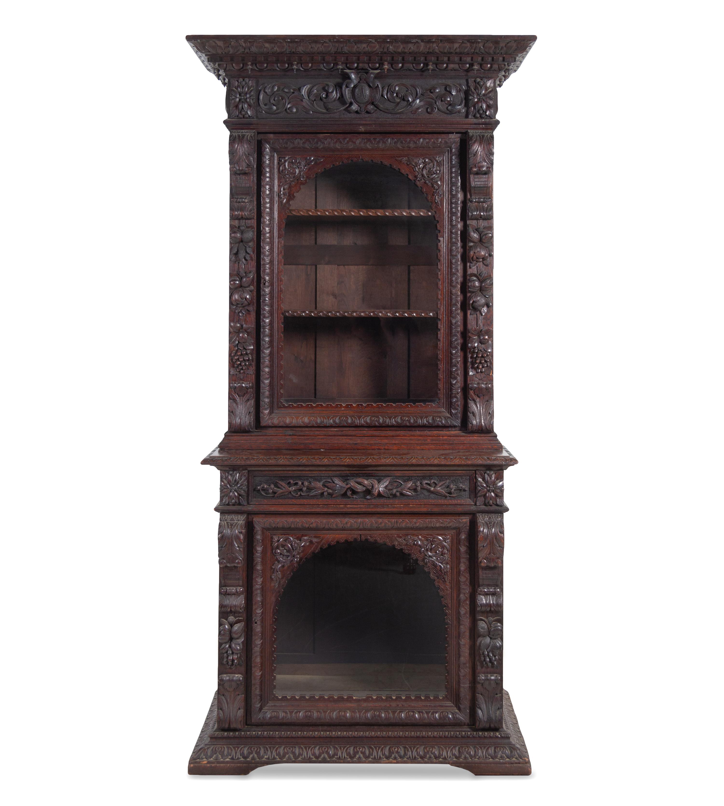 A Renaissance Revival Carved Oak Two-Part Cabinet
