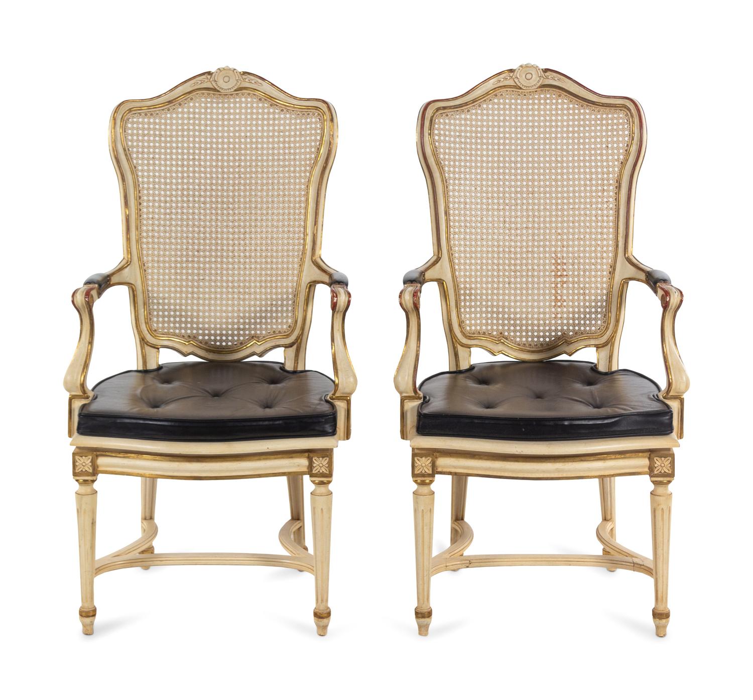 A Pair of Louis XV Style Painted and Caned Fauteuils