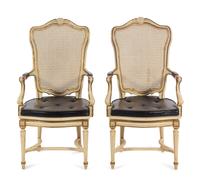 A Pair of Louis XV Style Painted and Caned Fauteuils