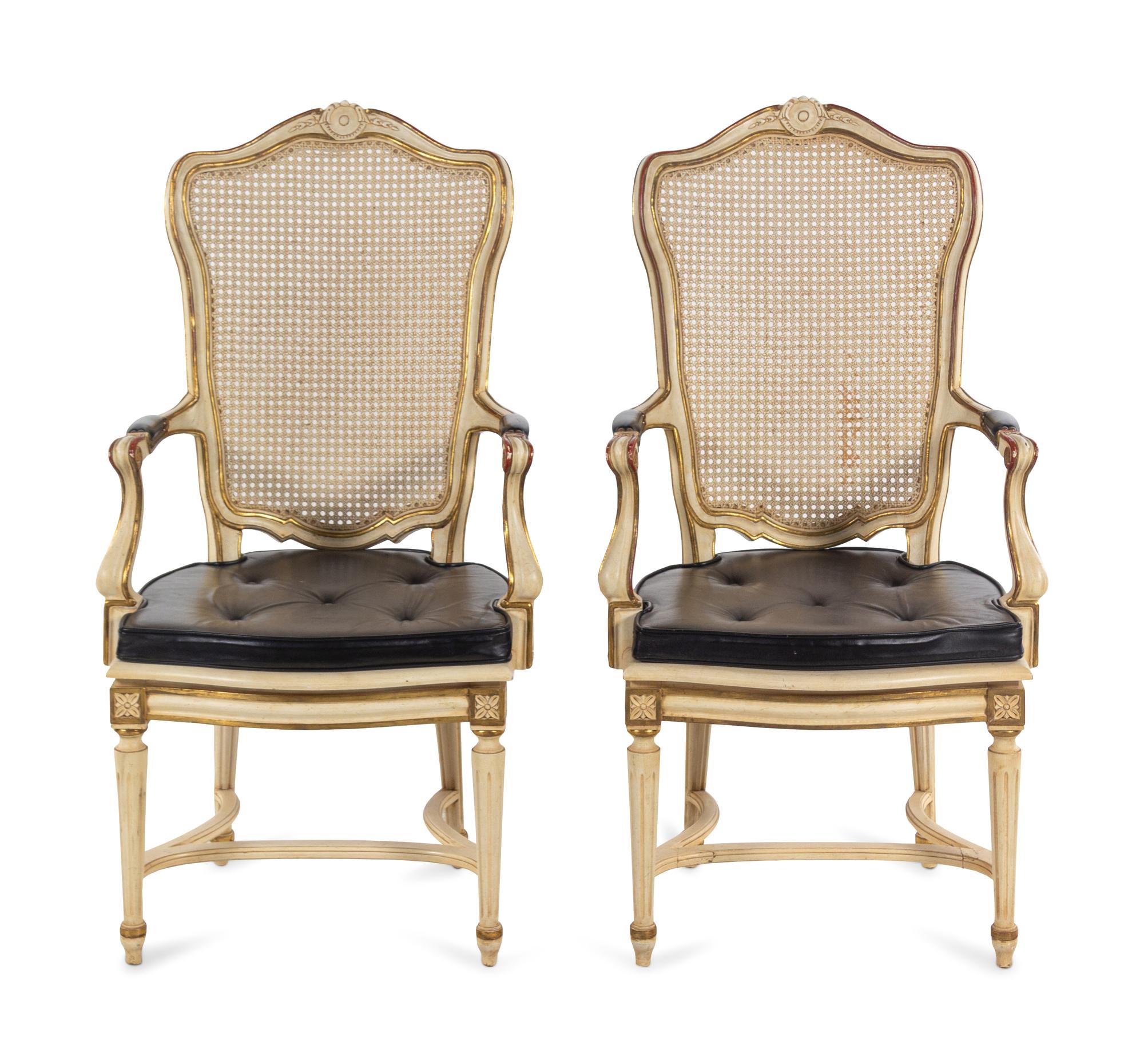 A Pair of Louis XV Style Painted and Caned Fauteuils