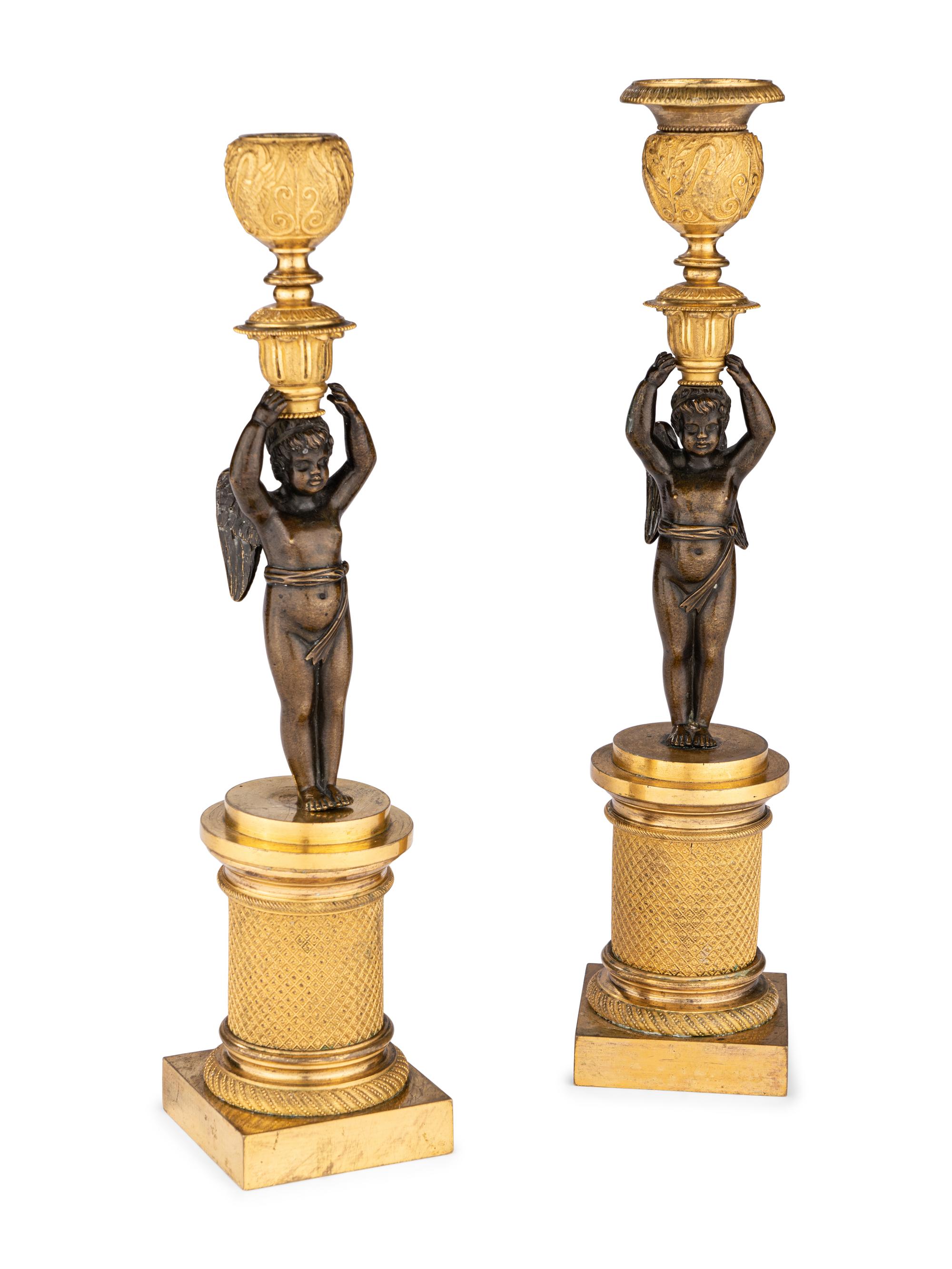 A Pair of Restauration Ormolu and Patinated Bronze Figural Candlesticks