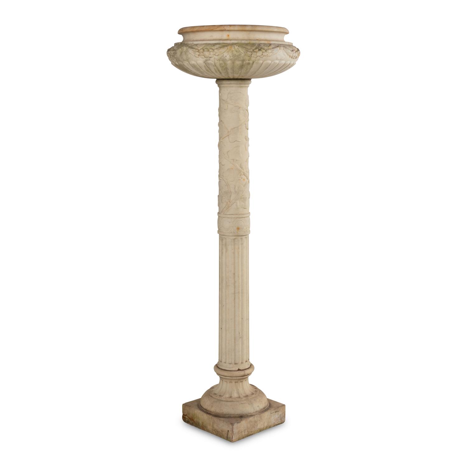 A Pair of Carved Marble Jardinières on Pedestals