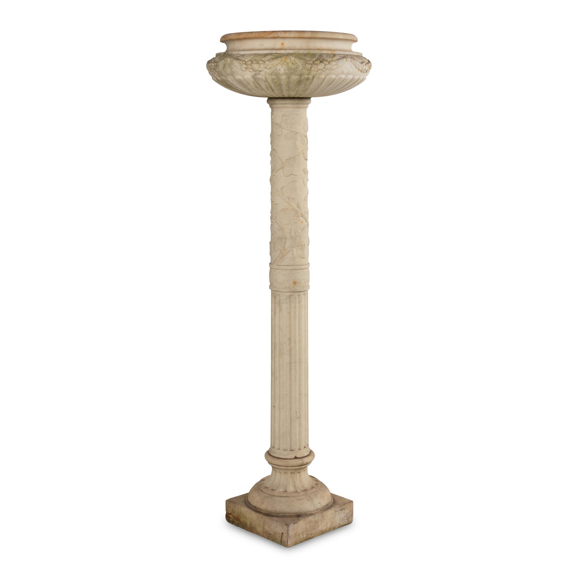 A Pair of Carved Marble Jardinières on Pedestals