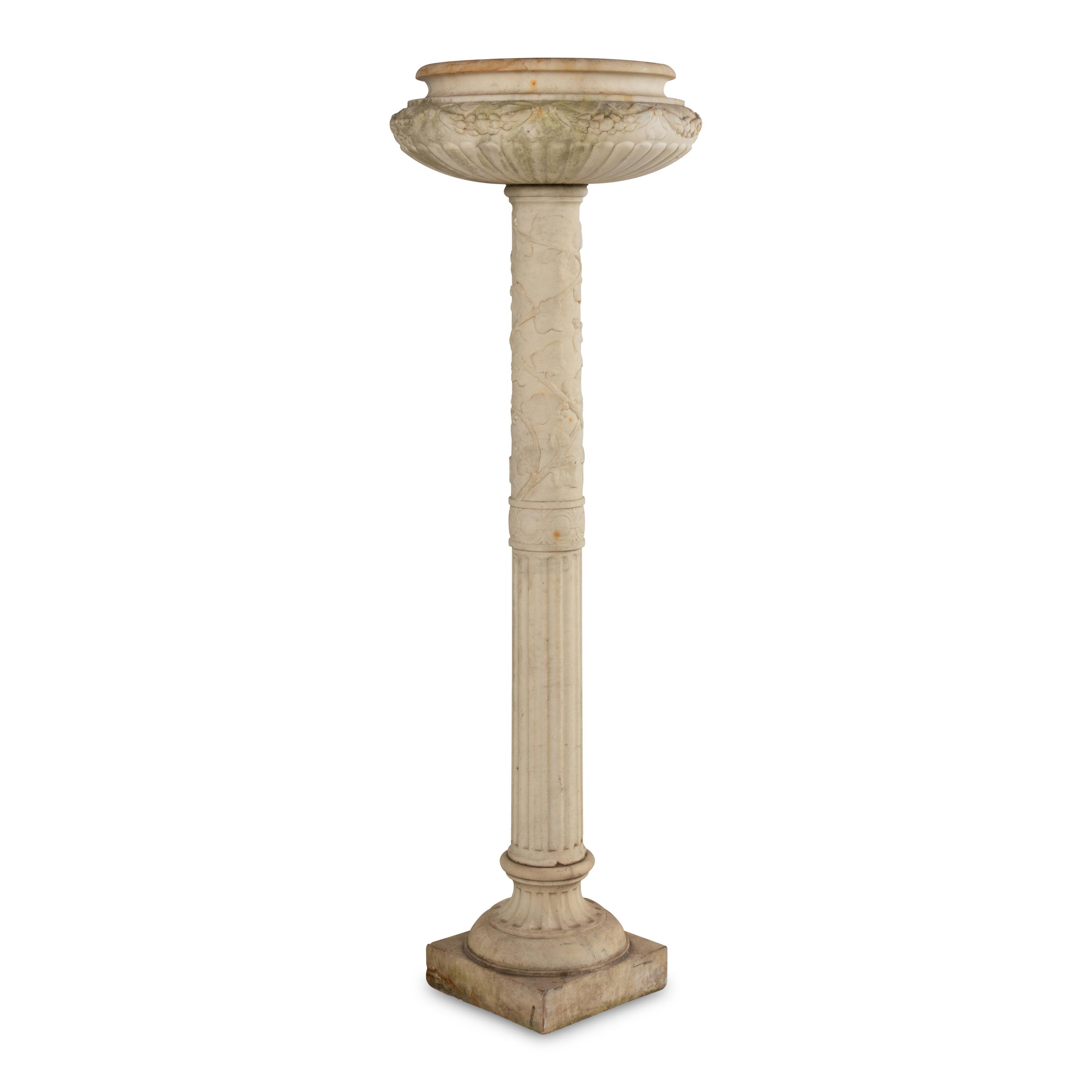 A Pair of Carved Marble Jardinières on Pedestals