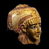 An Egyptian Gilt Cartonnage Mummy Mask of a Woman