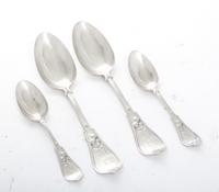 A Collection of American Coin Silver Spoons, , comprising 6 table spoons and 12 teaspoons, each with foliate and berry decorated handle