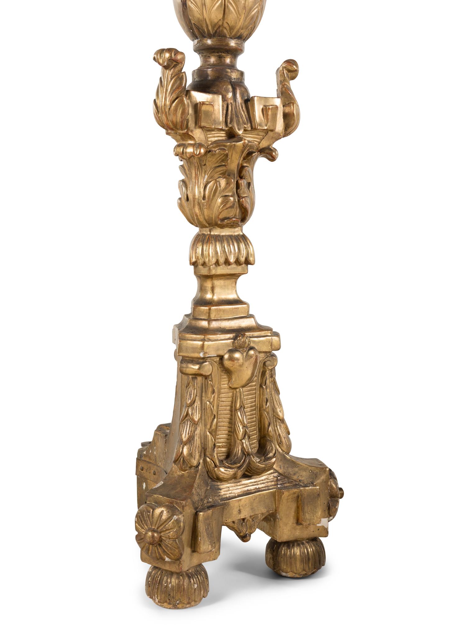 A Set of Four Continental Baroque Style Carved Giltwood Torchères