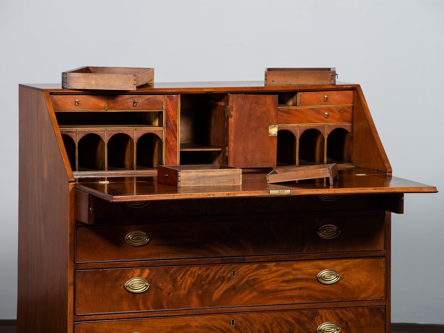 A Chippendale Figured Mahogany Slant-Front Desk
