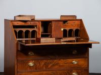 A Chippendale Figured Mahogany Slant-Front Desk