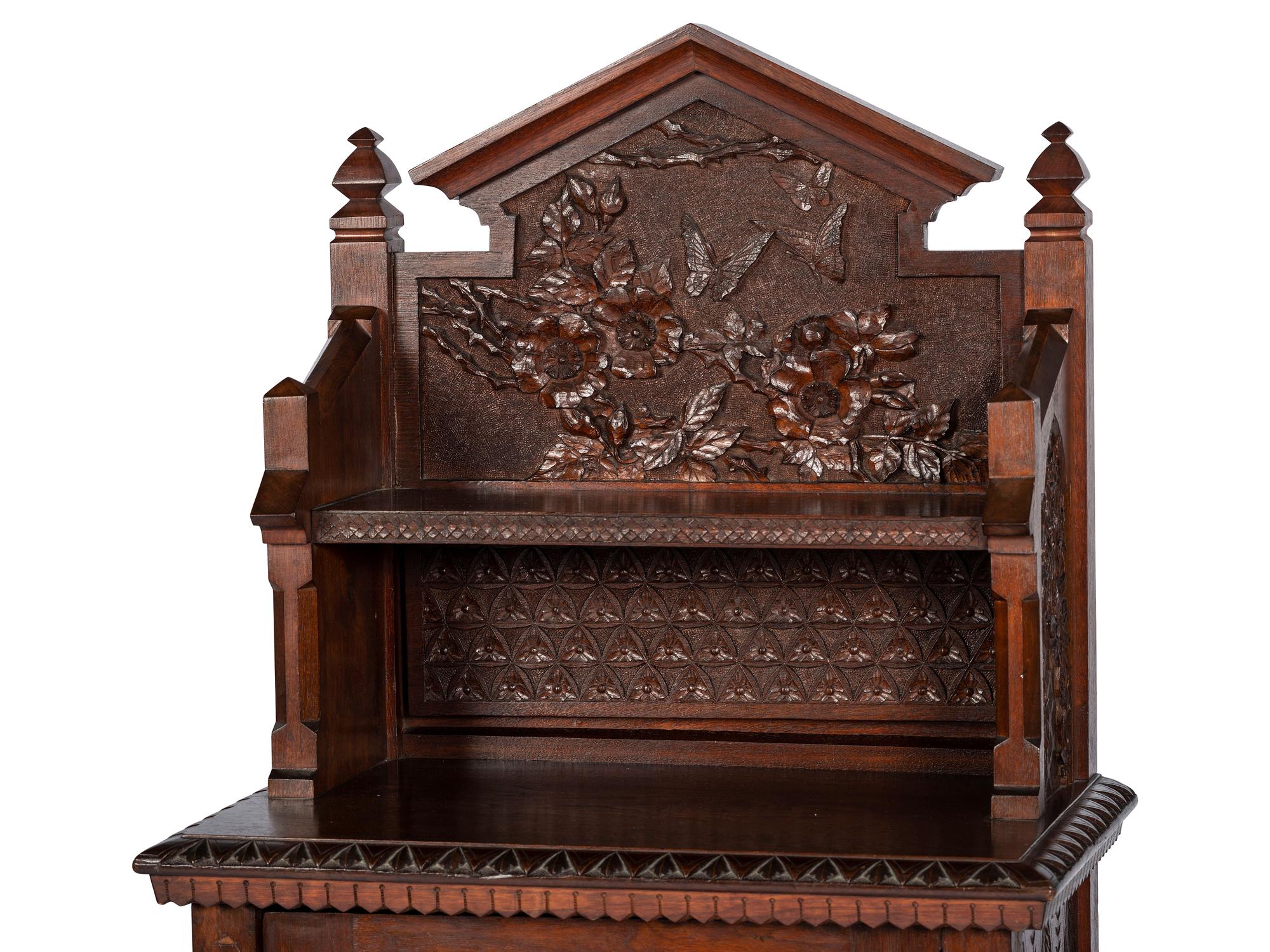 with carved floral and butterfly motifs