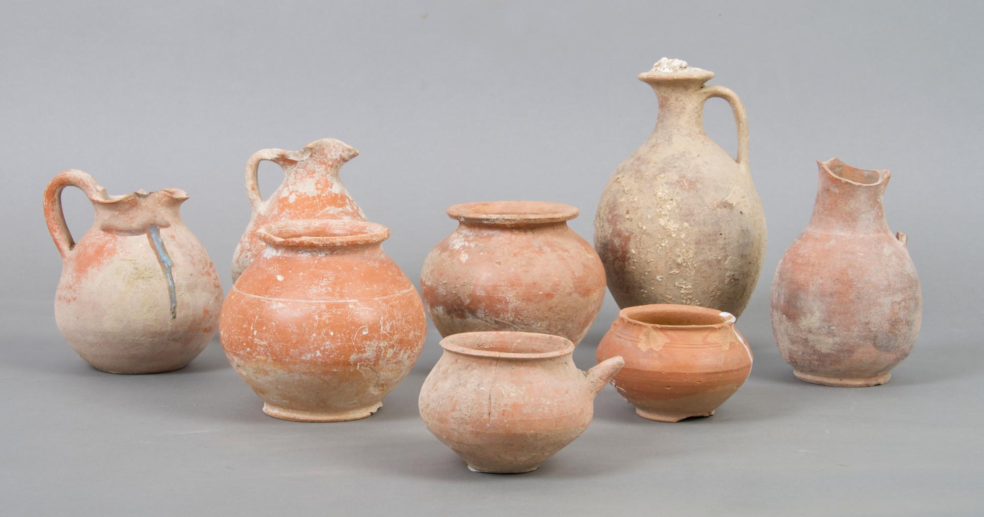 A Collection of Ten Roman or Near East Earthenware Vessels, Height of tallest 7 inches.