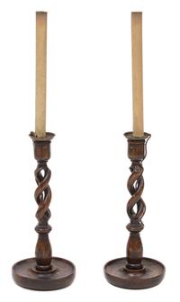 A Pair of Walnut Barley Twist Candlesticks Overall height 26 inches.