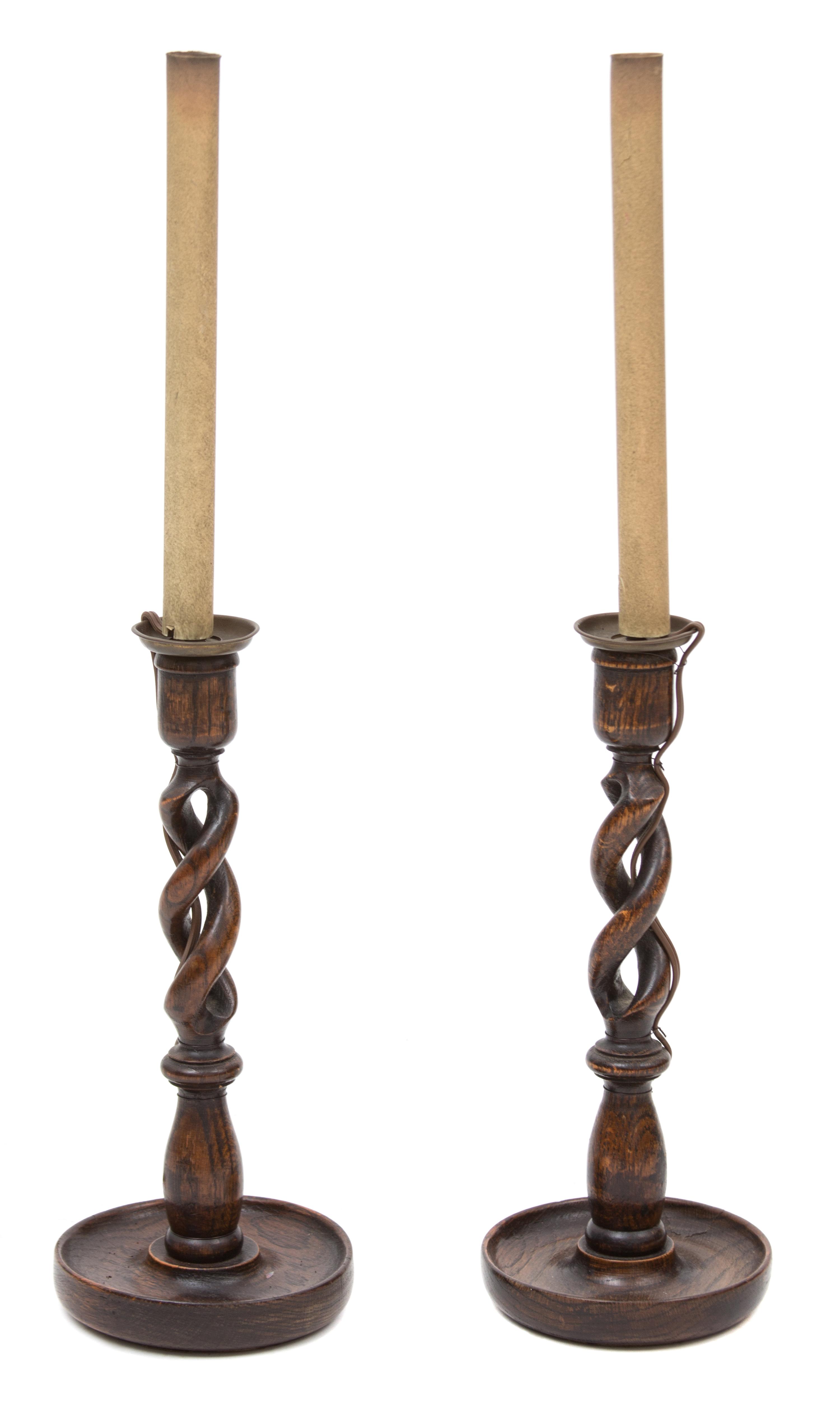 A Pair of Walnut Barley Twist Candlesticks Overall height 26 inches.