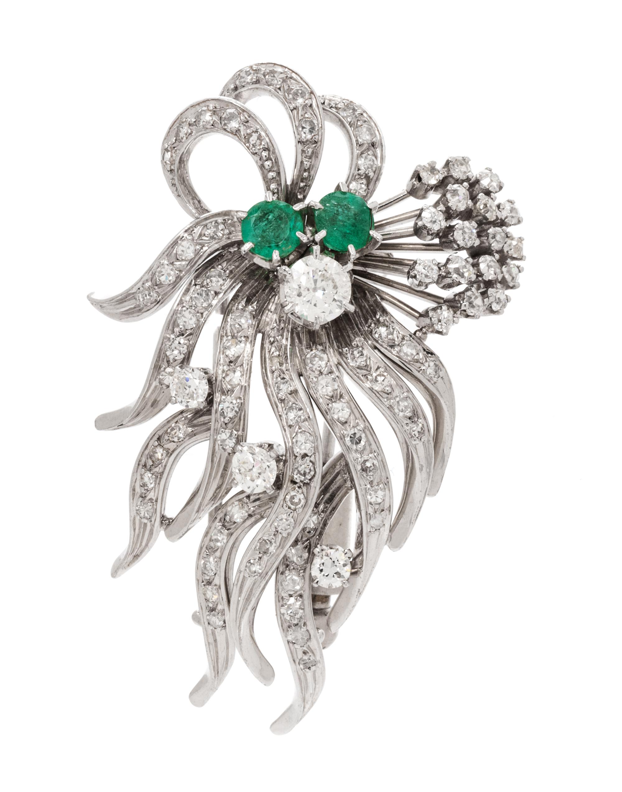 A Platinum, Diamond and Emerald Spray Brooch, 15.70 dwts.