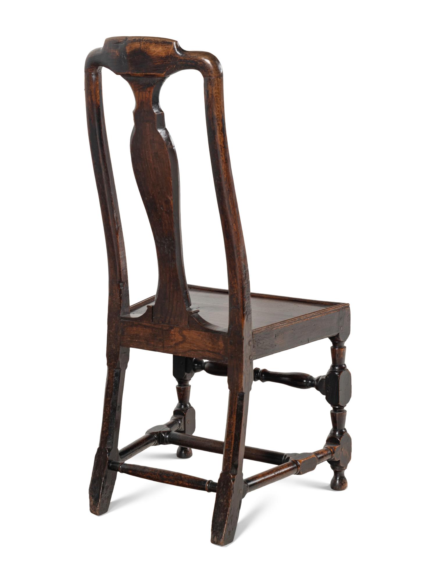 A Pair of Queen Anne Oak 'Solid Seat' Side Chairs