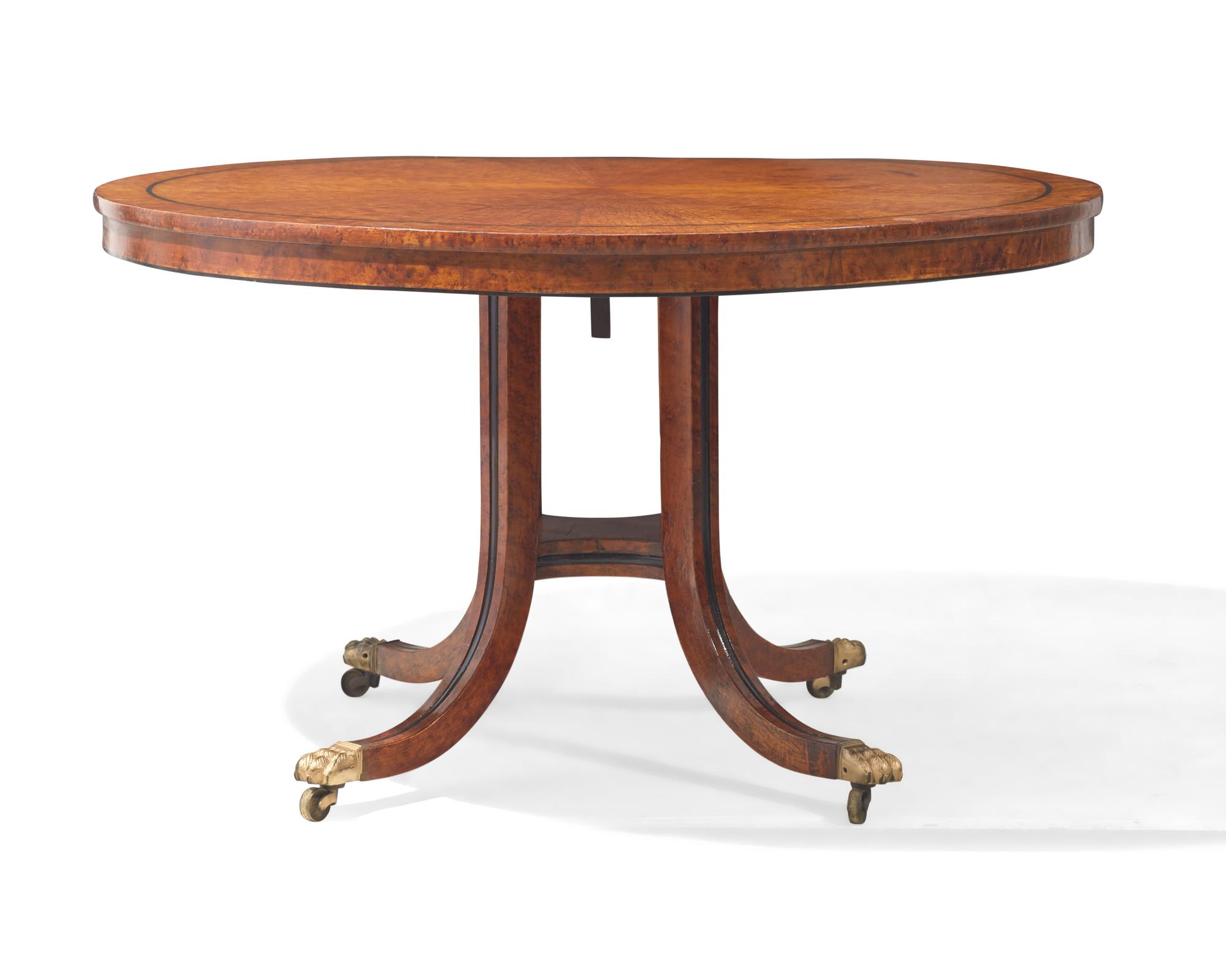 A Regency parcel-ebonized pollard oak breakfast table, circa 1820