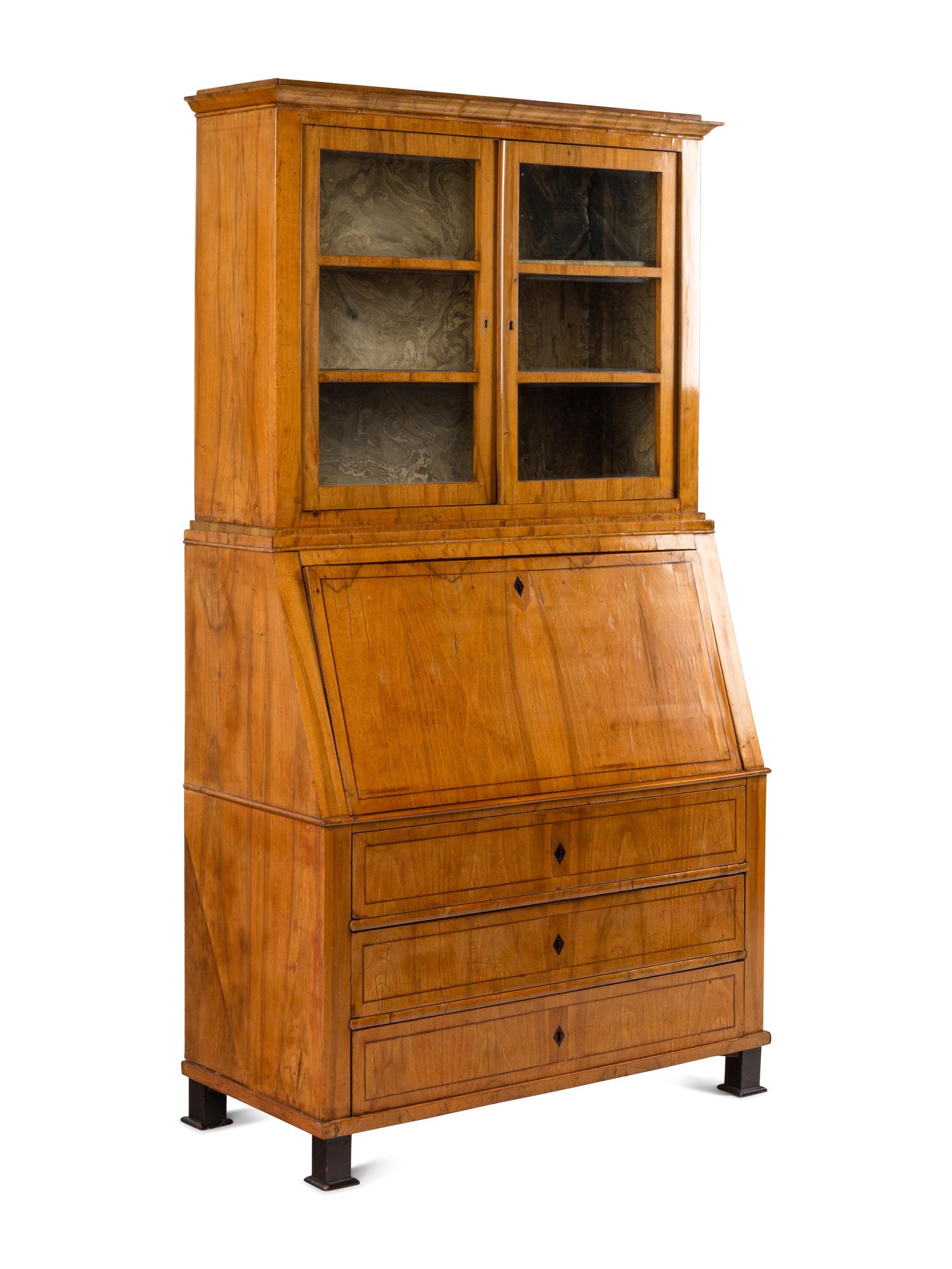 A Biedermeier Figured Walnut Secretary Bookcase