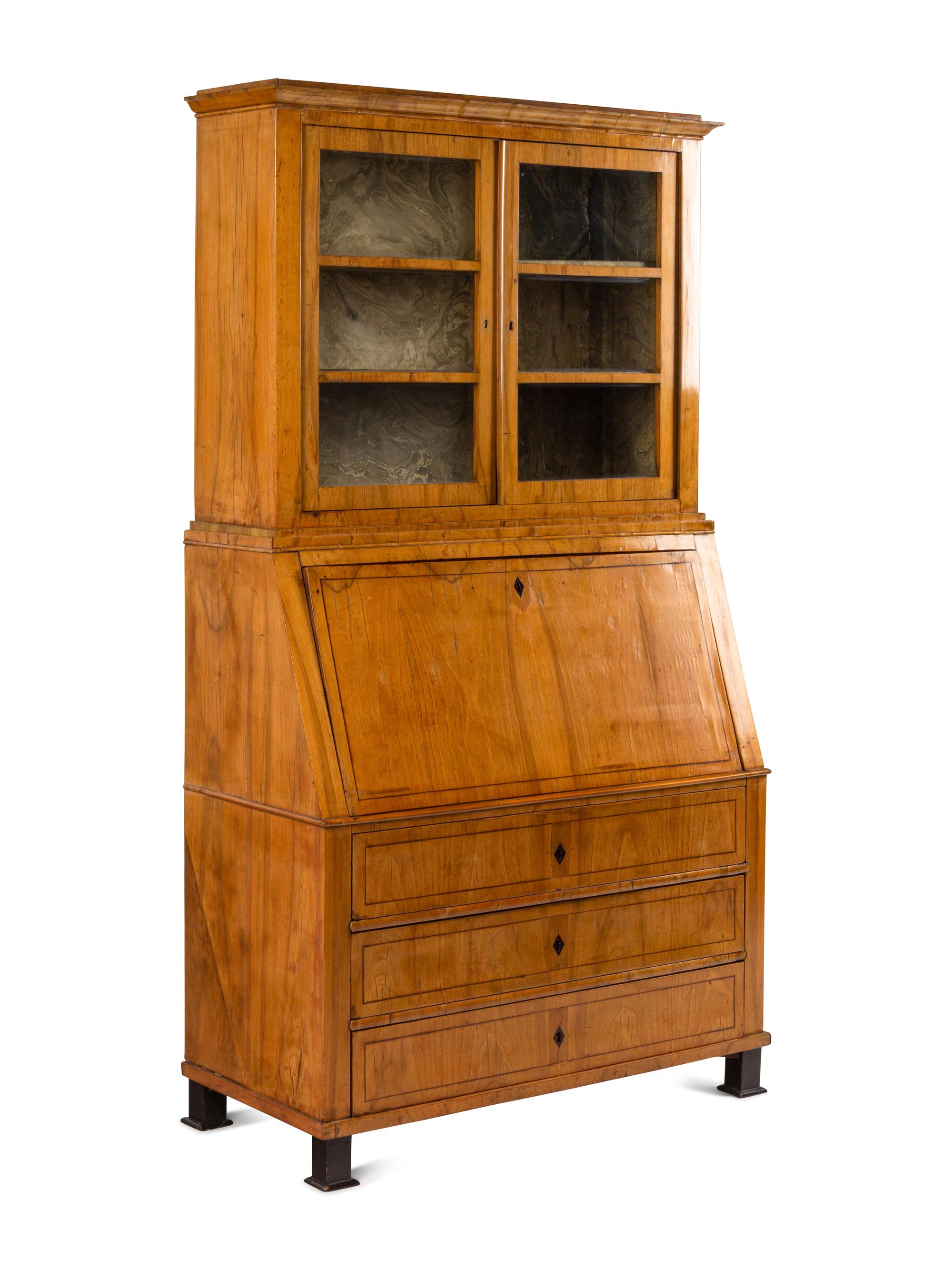 A Biedermeier Figured Walnut Secretary Bookcase