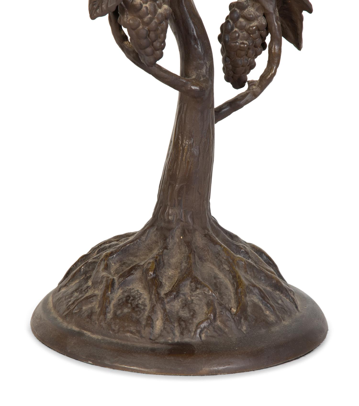 A Leaded Glass and Cast Metal Table Lamp