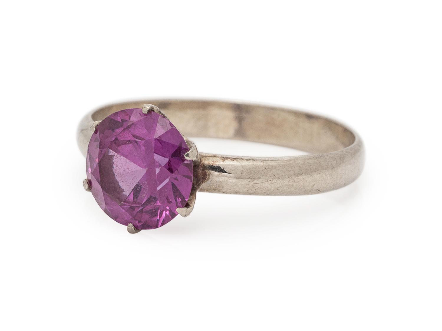 A 14 Karat White Gold and Synthetic Color Change Sapphire Ring,