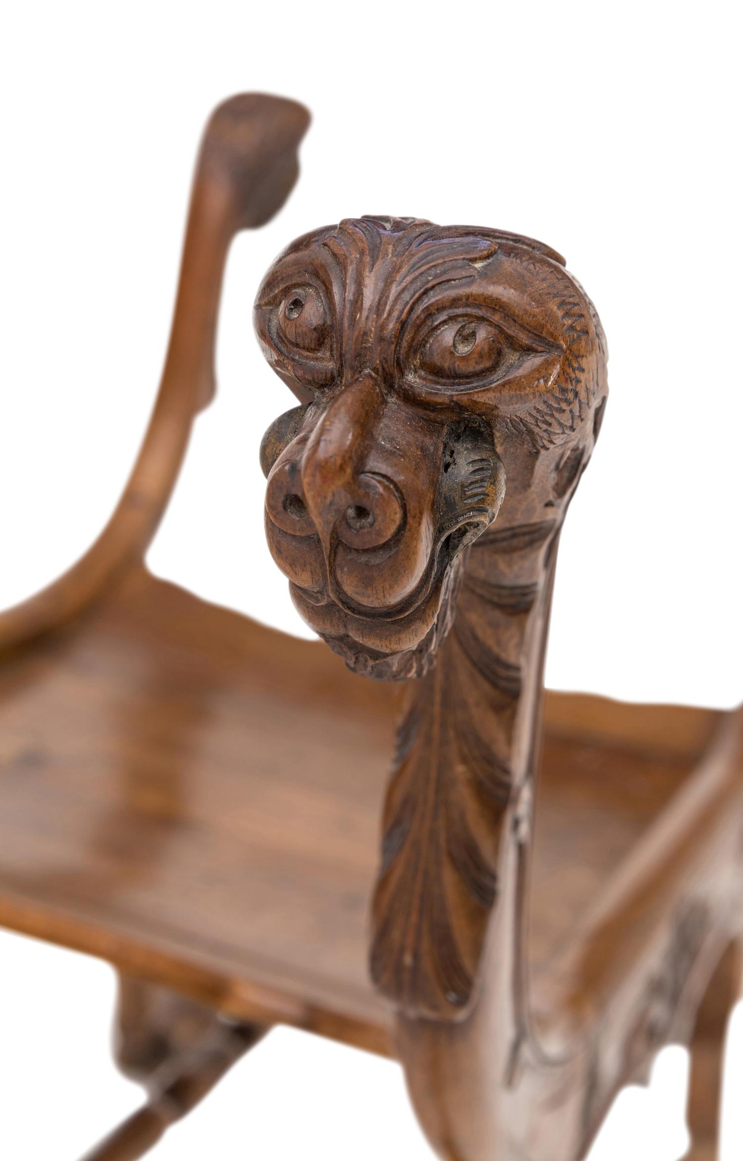 A Renaissance Revival Carved Walnut Curule Bench
