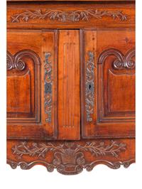 A Louis XV Provincial Carved Walnut Cabinet