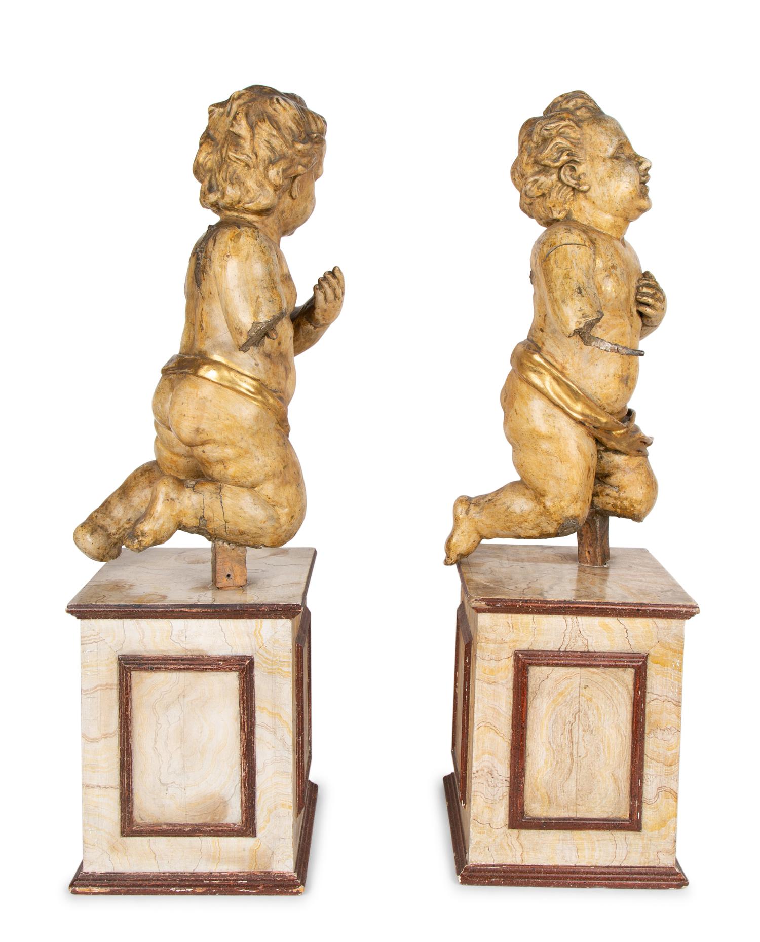 A Pair of Italian Carved and Parcel Gilt Cherubs — 19TH CENTURY