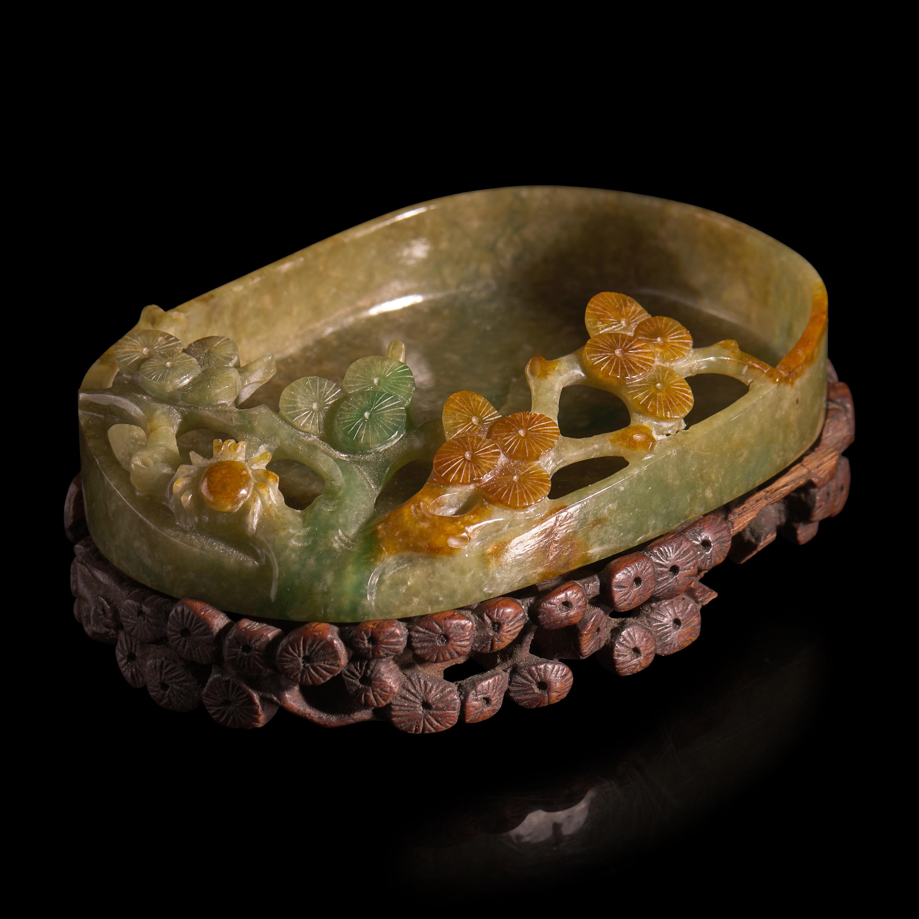 A Chinese Carved Jadeite "Pine and Spider" Brush Washer and Carved Wood Stand, Qing Dynasty — 清 翡翠鏤雕松紋洗