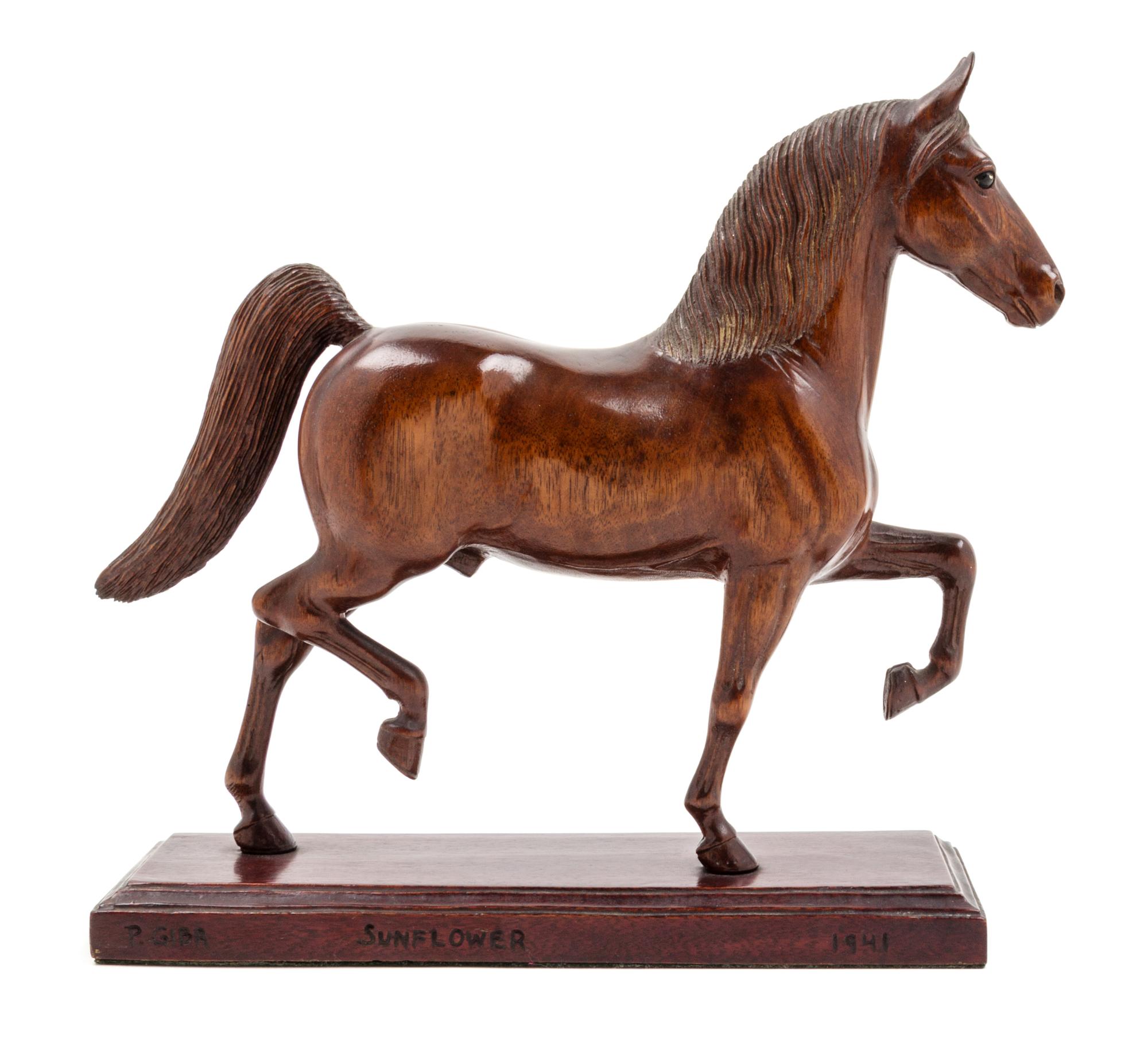 A Carved Wood Figure of a Thoroughbred Horse Height 12 1/4 inches. — PETER GIBA, 1941
