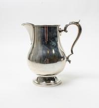 An American Silver Water Pitcher, M. Fred Hirsch Co., Jersey City, NJ, of baluster form, raised on a circular foot.